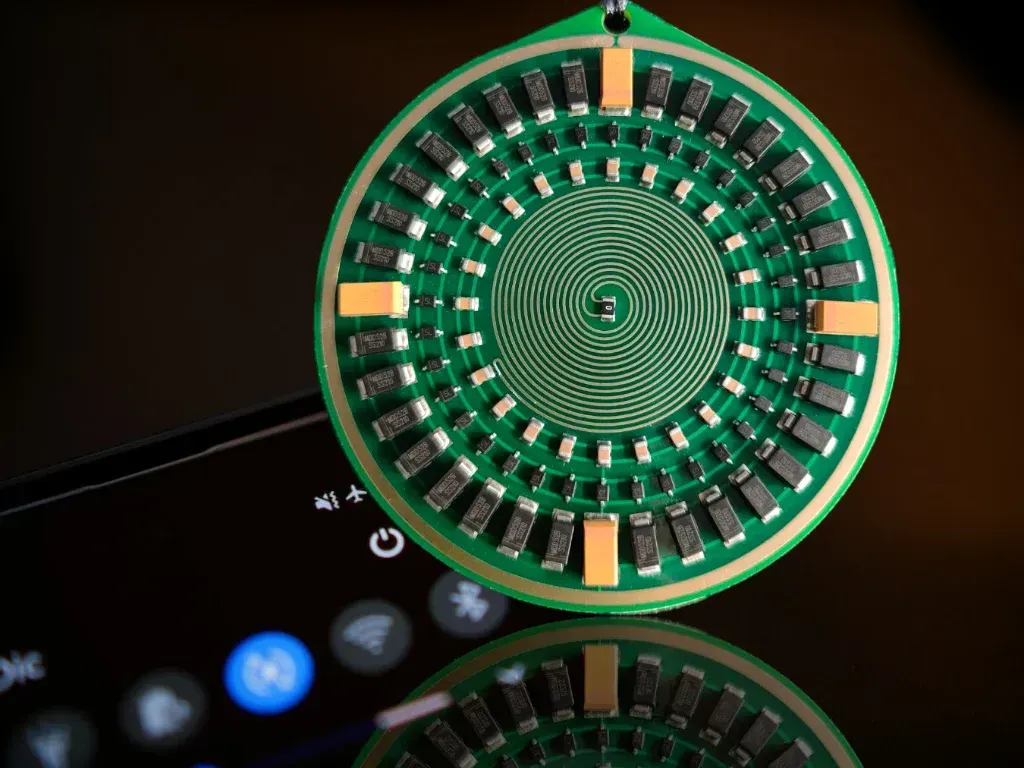 Golden Aspis pendant with layered radionics antenna geometry